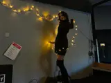 a girl hanging Christmas lights